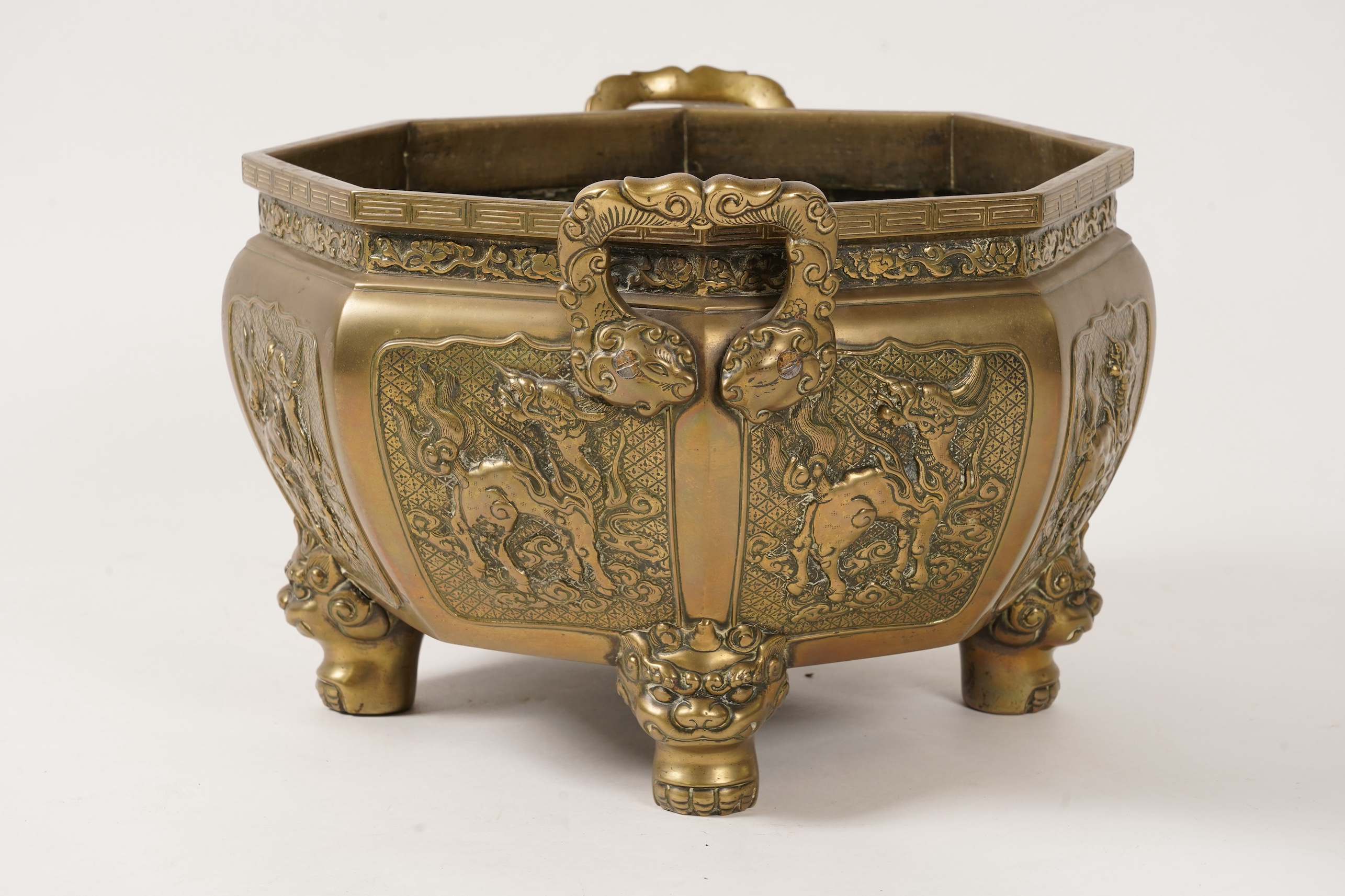 A large Chinese or Japanese bronze octagonal jardiniere, 19th century
